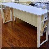 F56. White laminate console table. 30”h x 67”w x 16”d- $28 